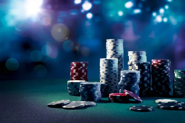 Close-up of live Dragon Tiger card table with dealer hands and chips